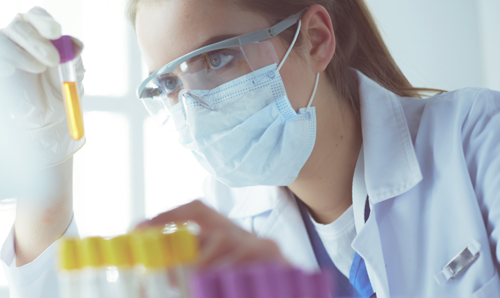 Researcher, doctor, scientist or laboratory assistant working with plastic medical tubes in modern lab or hospital