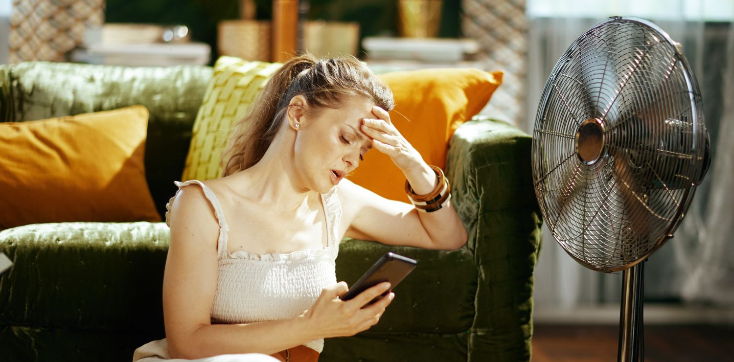 Woman experiencing hot flashes