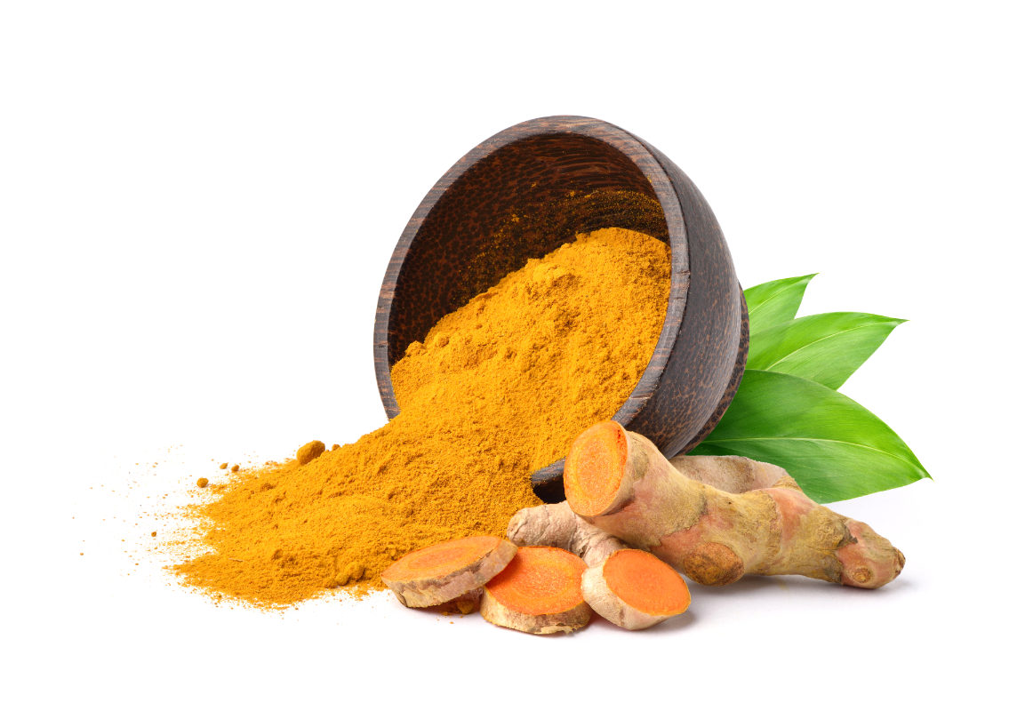 Turmeric (Curcuma longa Linn) powder pouring from wooden bowl with rhizome (root) slices on white background.